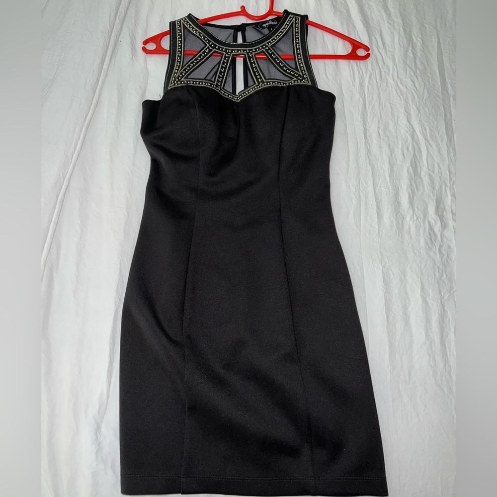 Tight black dress with beading